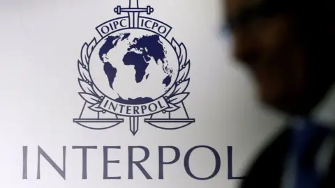 PA Media Interpol logo