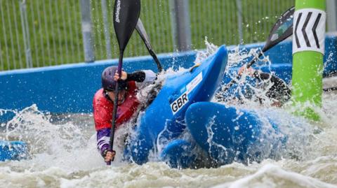 Kimberley Woods competes in kayak cross at the World Championships