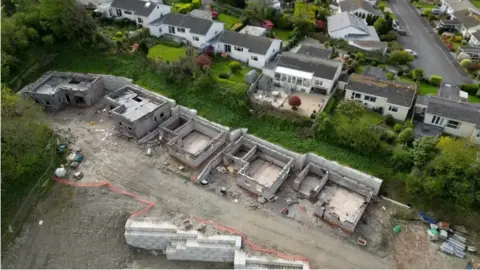 Lock's Hill in Kingsbridge, Devon, with fives homes seen to have been partially built