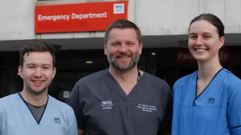 NHS Grampian Gareth Patton, consultant in emergency medicine; Charlotte Pinkerton, staff nurse; and Alexander Brooks, senior health care support