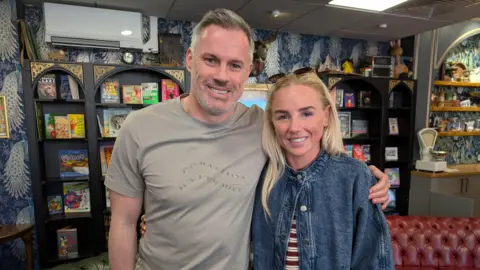 Jamie Carragher and Alex Greenwood stand for a photo. 
