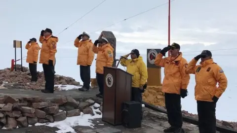 Argentine Navy Members of the crew of the ARA Iríza salute during a ceremony
