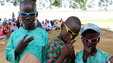 Getty Images Boys in sunglasses at Eid prayers in Djiakaking, Segou, Mali - Saturday 9 July 2022