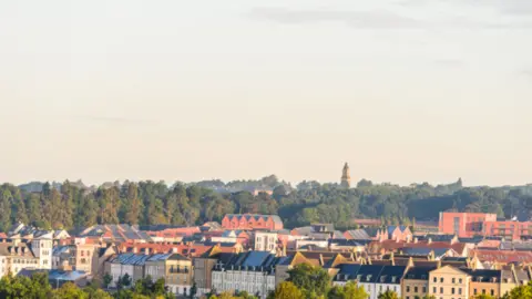 West Northamptonshire Council An aerial view of a town with terrace houses.