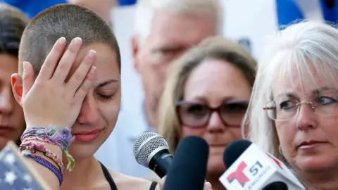 AFP Florida High School shooting: Marjory Stoneman Douglas High School student Emma Gonzalez reacts during her speech at a rally for gun control at the Broward County Federal Courthouse in Fort Lauderdale, Florida on February 17, 2018.