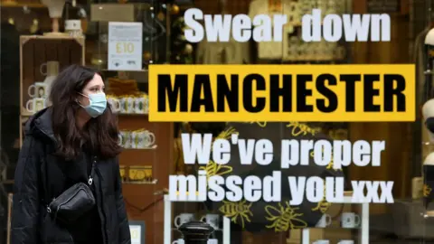Getty Images woman in mask in manchester