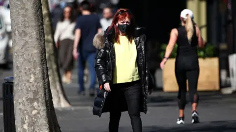 Getty Images A woman exercises in Auckland as it remains under lockdown