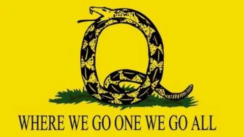 BBC Picture of a snake in the shape of a letter Q and the slogan "where we go one we go all"