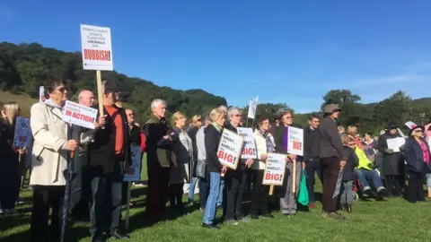 BBC People holding placards in Abermule