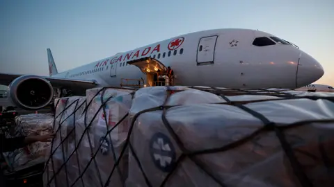 Getty Images Toronto: a plane prepares to fly aid to Poland, where it will be delivered overland to Ukraine