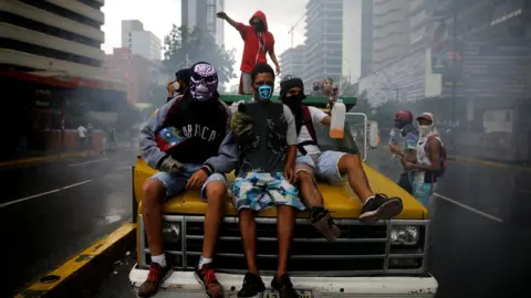 Reuters Demonstrators ride on a truck while rallying against Venezuelan President Nicolas Maduro's government in Caracas, June 29, 2017