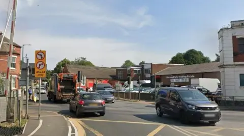 A number of cars on a road.