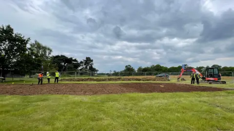 Shaun Whitmore/BBC Excavation work under way at Sutton Hoo