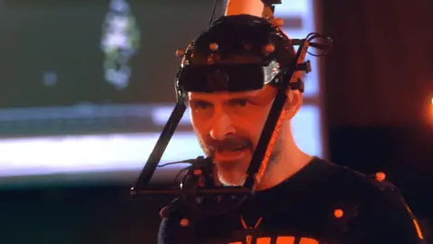 Youtube/Assassin's Creed Official Mark Bonnar wearing motion capture gear.