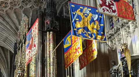 BBC Banners hang near the ceiling of a chapel 