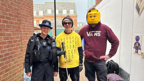 Police woman pictured with Clarke Reynolds and Bricksy