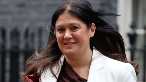 EPA Lisa Nandy pictured outside Downing Street wearing a white jacket and carrying a red folder