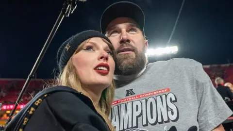 Getty Images Taylor Swift and Travis Kelce pictured together at an American Football game