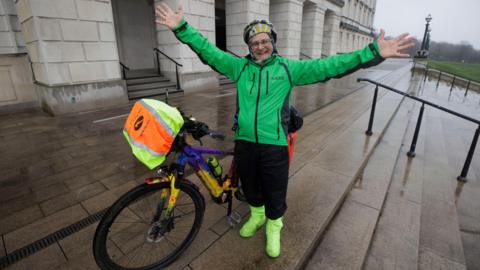 Timmy Mallett beside his bicycle at Stormont