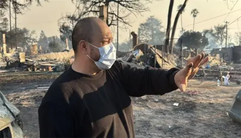 Larry shows his destroyed home