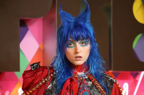 Getty Images Picture of Ashnikko with her hair in blue horns