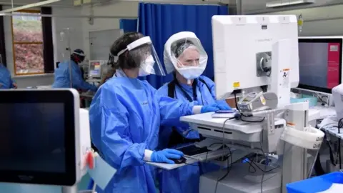 Reuters Nurses monitor patients on a COVID-19 ward at Milton Keynes University Hospital