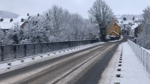 Baskerville Paul | BBC Weather Watchers Snowy roads and rooftops at Clyro, near Hay-on-Wye