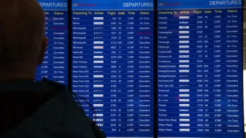 Getty Images Airlines have cancelled thousands of flights in an out of the US