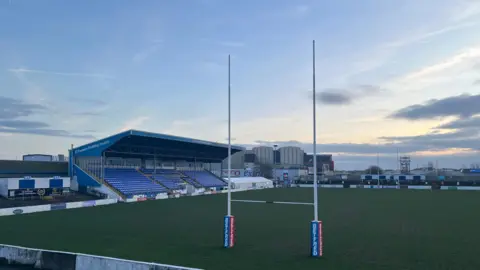 The rugby pitch and seating area.