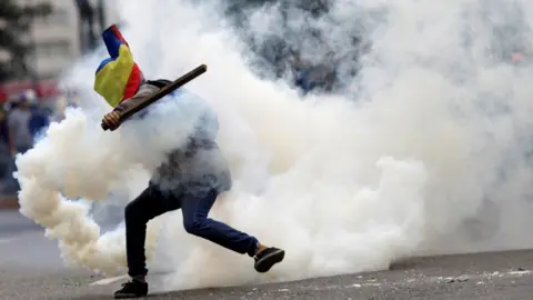 Reuters A demonstrator clashes with riot security forces during a rally against the Venezuelan government in July 2017