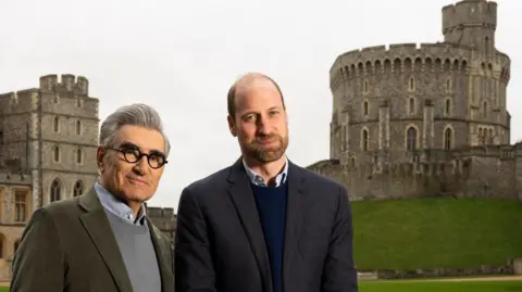 AppleTV+/PA Eugene Levy and Prince William outside Winsdor Castle