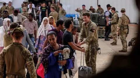 Reuters British nationals board a plane during their evacuation