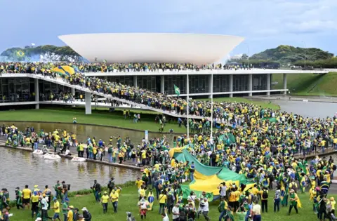 Getty Images Supporters of Brazilian former President Jair Bolsonaro hold a demonstration at the Esplanada dos Ministerios in Brasilia on January 8, 2023