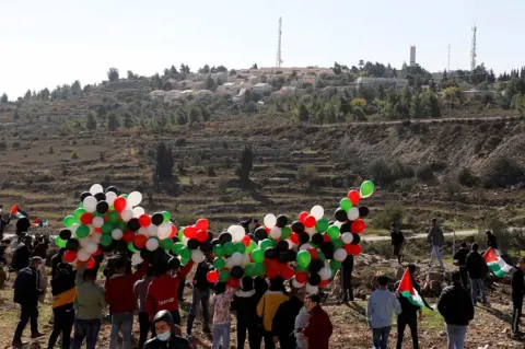 Reuters Palestinians protest near the settlement of Psagot in the occupied West Bank on 18 November 2020