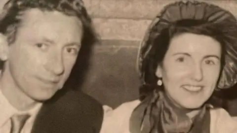 Family photograph Black-and-white image of Eddie Morgan wearing a suit and his bride Mary Gorry wearing a bonnet.