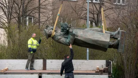 Getty Images Workers remove a statue of Ivan Konev in Prague