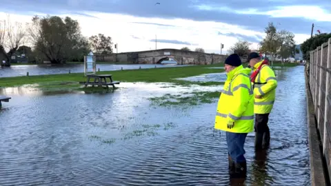 Robby West/BBC Flood wardens in Potter Heigham