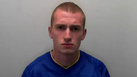 North Yorkshire Police A police mugshot of Matthew Hull, a young man who has short blonde hair and dark eyes.