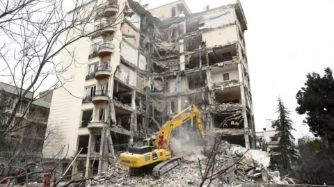 A view of a residential building damaged by a strike, amid the US-Israeli conflict with Iran, in Tehran, Iran, March 23, 2026