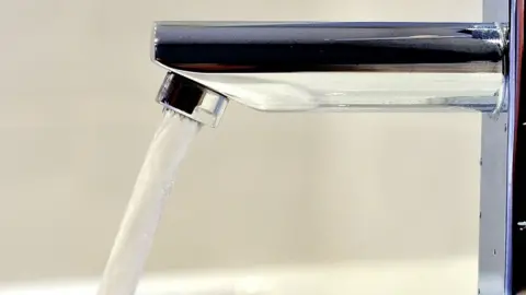 Water flowing from tap