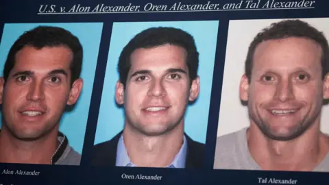 Photographs of Alon, Oren, and Tal Alexander displayed prior to a news conference in New York.