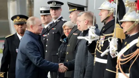 Getty Images Russian President Vladimir Putin arrives at Paris' Charles-de-Gaulle airport, 9 December 2019
