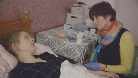 Hannah, lying in bed