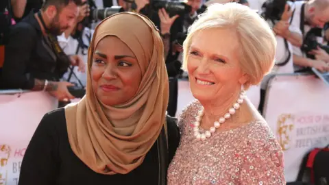 Getty Images Nadiya Hussain and Mary Berry pictured on the red carpet at the Bafta TV Awards in 2016