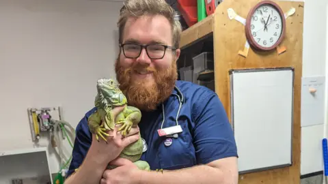 Dr Matt Guy Dr Matt Guy holding a reptile