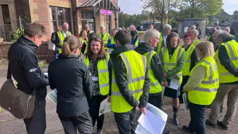 people gathered ahead of the site visit to lomond banks