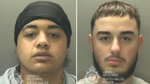 A composite image - a mugshot of two men. The one on the left has a black headwrap and looks at the camera. The one on the right has a black beard and moustache and short black hair