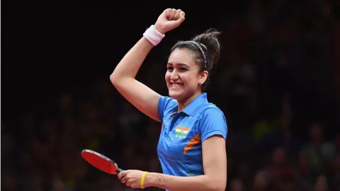 Getty Images Manika Batra celebrates defeating Mengyu Yu of Singapore during the Women's Singles Gold Medal Table Tennis match on day 10 of the Gold Coast 2018 Commonwealth Games