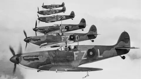Getty Images Flying Officer Robert Stanford Tuck flying aircraft registration FZ-L number K9906 leads two flights of No.65 Squadron Royal Air Force Fighter Command Supermarine Spitfire Mk1's in step-down formation out of RAF Hornchurch in May 1939.