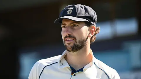 Ben Aitchison wearing a Derbyshire County Cricket Club cap